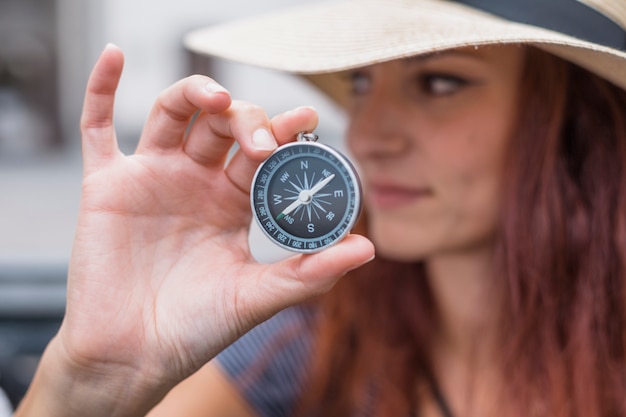 Free photo female tourist with compass