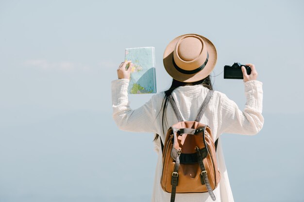 Female tourists spread their arms and held their wings