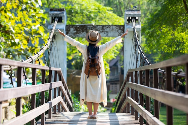 Female tourists spread their arms and held their wings