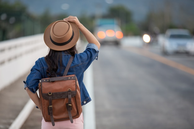 Female tourists spread their arms