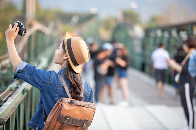 Female tourists who are taking photos of the atmosphere