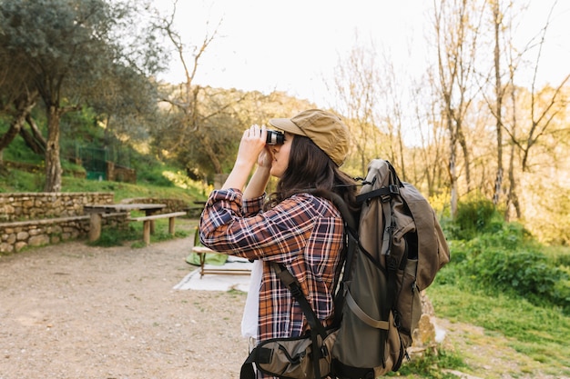 Female traveller with binoculars