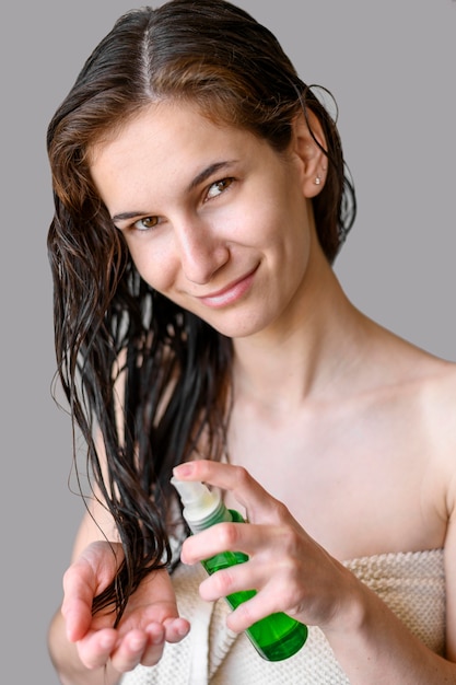 Free photo female using hair oil