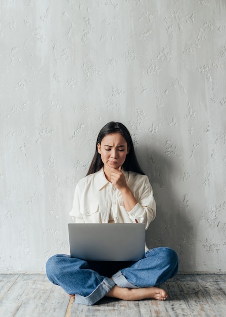 Female vlogger being thoughtful