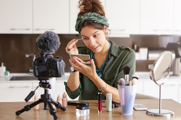 Free Photo female vlogger filming makeup video