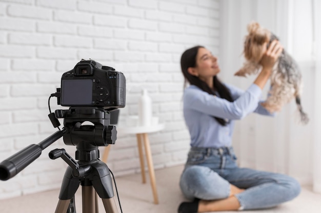 Female vlogger at home with camera