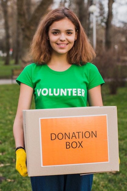 Free Photo female volunteer holding box for donations