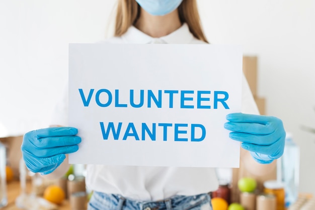 Free photo female volunteer holding paper with information