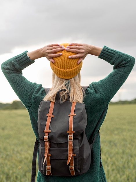 Free Photo female with backpack enjoying nature