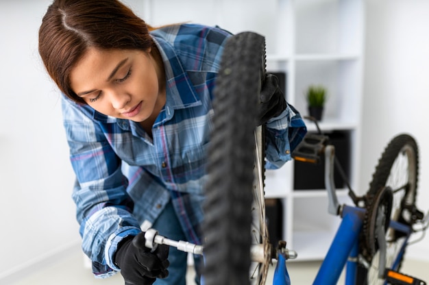 Free photo female working at bike