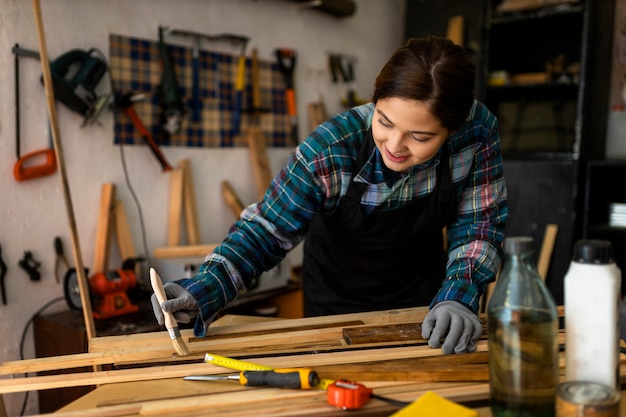 Female in workshop painting