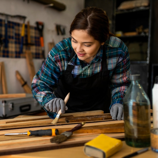 Female in workshop painting