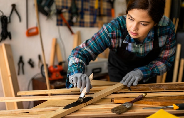 Female in workshop painting