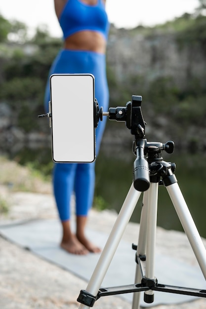 Free Photo female yoga teacher practicing outdoors