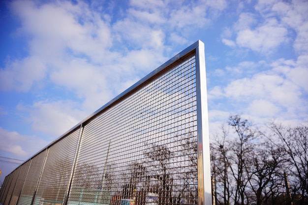 Fence near the tennis courts during daytime