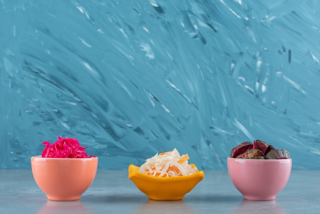 Free photo fermented vegetables in bowl , on the marble table.