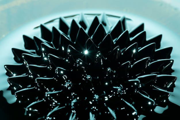 Ferromagnetic fluid phenomenon with blue coloured shades