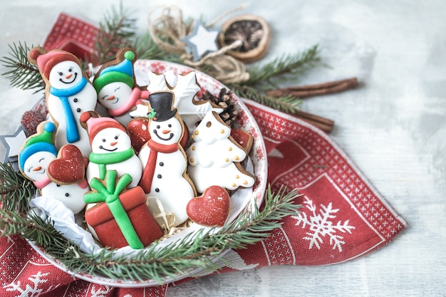 Festive new year gingerbread on a plate with decor .