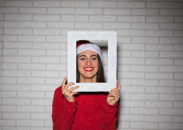 Free Photo festive woman with frame 