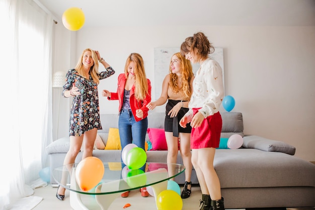 Free photo festive women friends with balloons