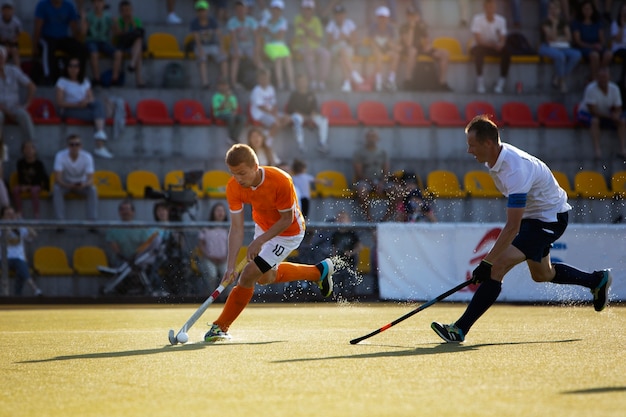 Free photo field hockey players during a tournament game