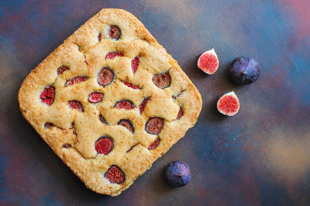 Fig cake with fresh figs on dark