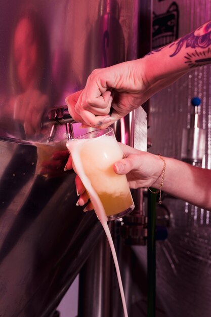 Filling beer in glass