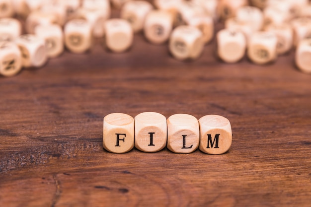 Free photo film word written on wooden cubes