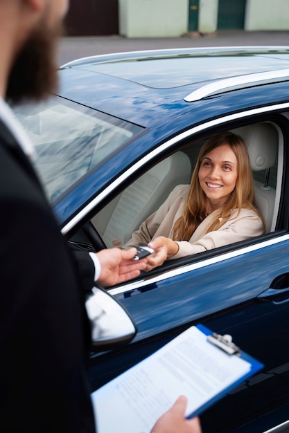 Free photo financial independent woman buying new car