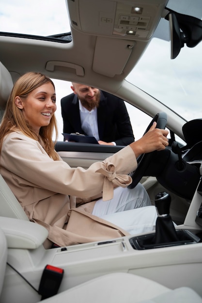 Free photo financial independent woman buying new car