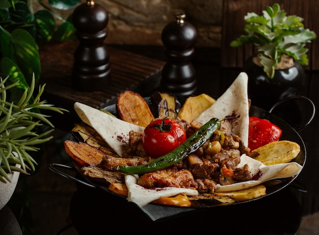 Finely grilled local sac ichi food served with lavash pieces