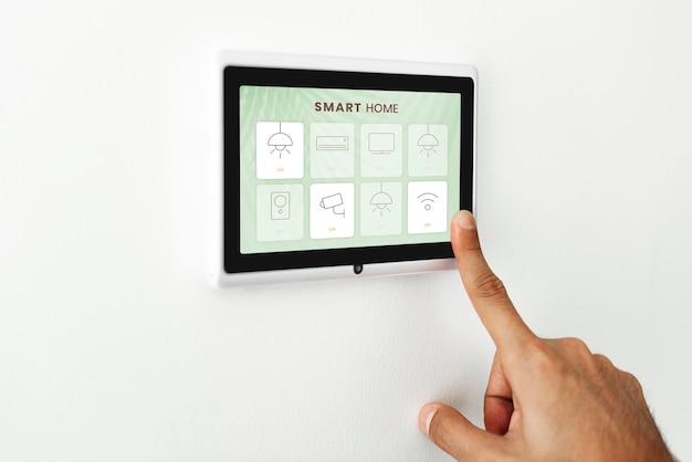 Free photo finger pressing on smart home automation panel monitor