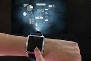 Free photo finger touching the smartwatch's screen