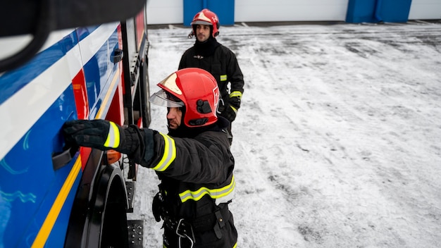 Free Photo firefighters ready for his mission