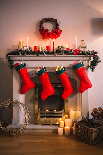 Fireplace decorated with christmas motifs and red socks