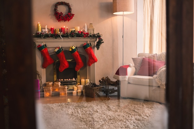 Free photo fireplace with red christmas socks