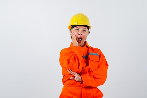 Firewoman in her uniform with a safety helmet