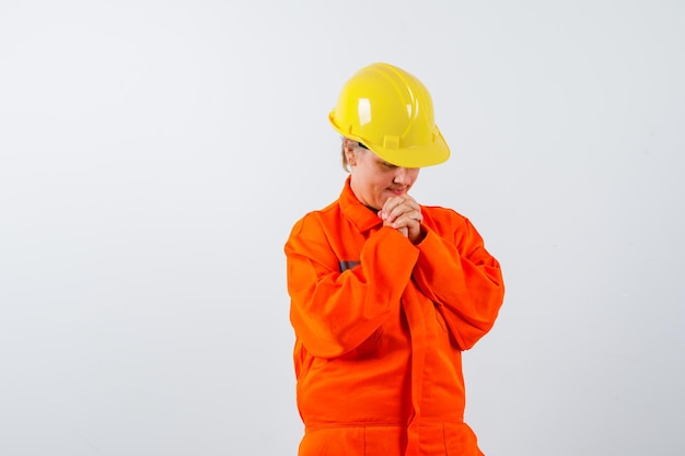 Free photo firewoman in her uniform with a safety helmet