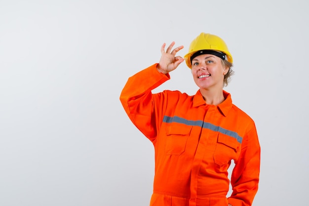 Firewoman in her uniform with a safety helmet