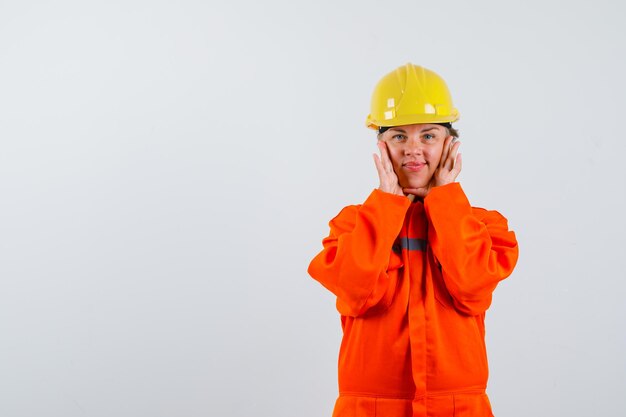 Firewoman in her uniform with a safety helmet