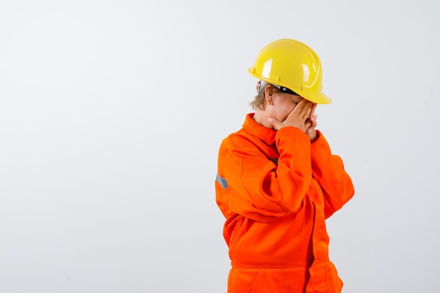 Free photo firewoman in her uniform with a safety helmet