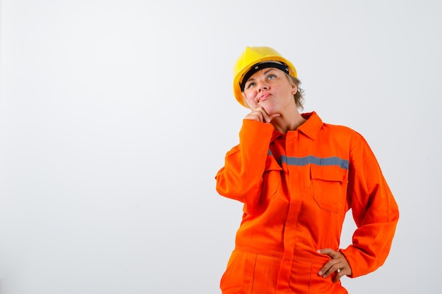 Firewoman in her uniform with a safety helmet