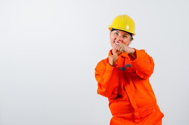 Firewoman in her uniform with a safety helmet