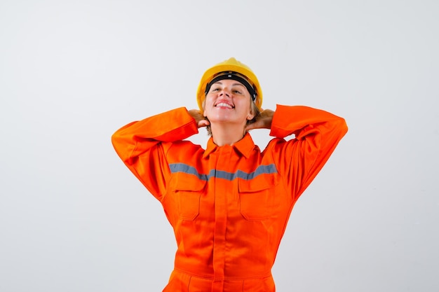 Free photo firewoman in her uniform with a safety helmet