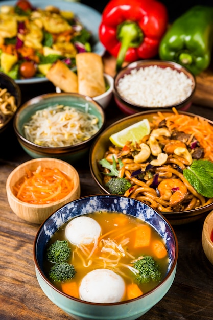 Fish ball soup and noodles bowl on wooden desk