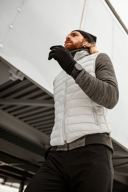 Free Photo fit man running outdoors medium shot