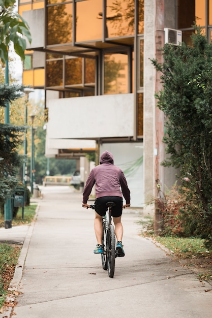 Fitness boy riding bike