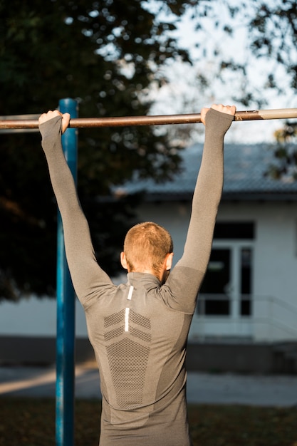 Free photo fitness boy stretching