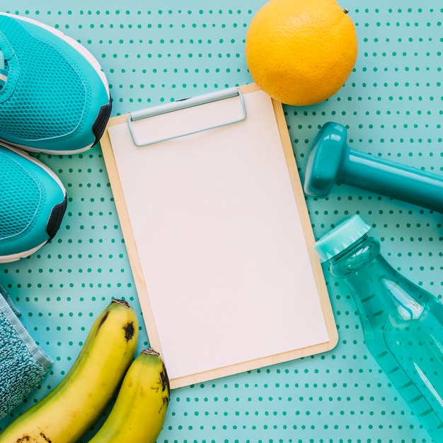 Fitness concept with clipboard and bottle