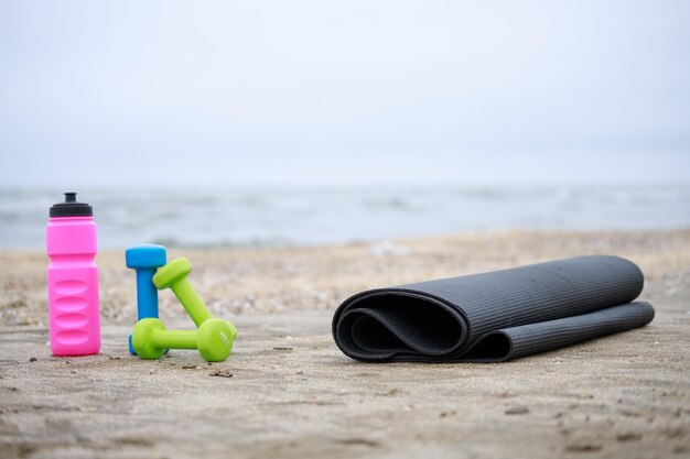 Fitness equipment on the ground at the beach High quality photo